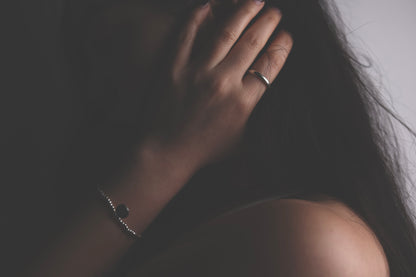 Handcrafted Minimalist Basic Silver Ring — model wearing smooth band with silver jewelry
