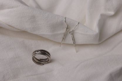 The Tribe Set — close-up of textured ring with drop earrings
