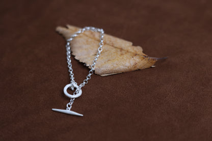 Handcrafted The Minimalist Basic Bracelet — chain bracelet over dried leaf