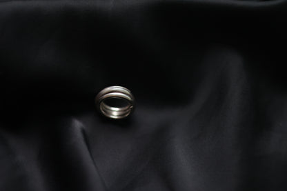 Handcrafted Silver Ring-The Loop — loop band on black fabric