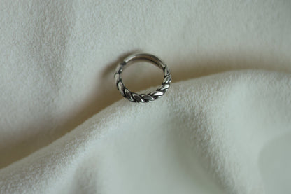 Handcrafted Braided Silver Ring-Unisex — braided band on pale fabric