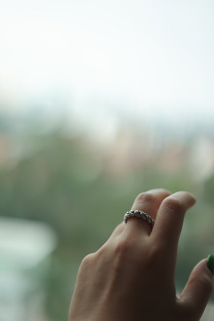 Handcrafted Braided Silver Ring-Unisex — braided band worn beside a window