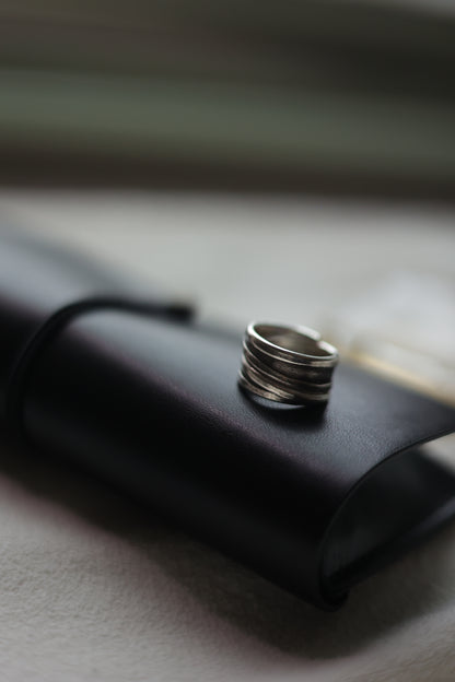 Handcrafted Silver Ring-Unisex — ridged band on a black case