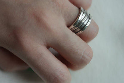 Handcrafted Silver Ring-Unisex — layered ridged band worn on a hand