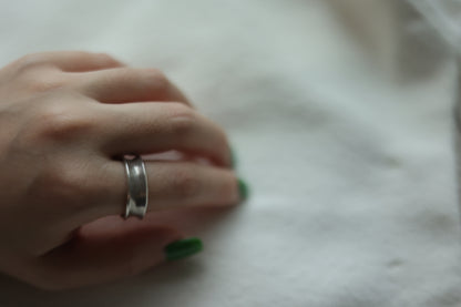 Minimalist Handmade Silver Ring — double-ridge band worn on a hand