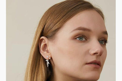 The Stars-Earrings — model wearing silver-tone star earring
