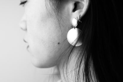 Handcrafted Frosted Minimalist Statement Earrings — close-up of round drop earrings worn on an ear