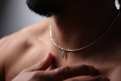 The Leaf Set — leaf-pendant necklace worn around the neck