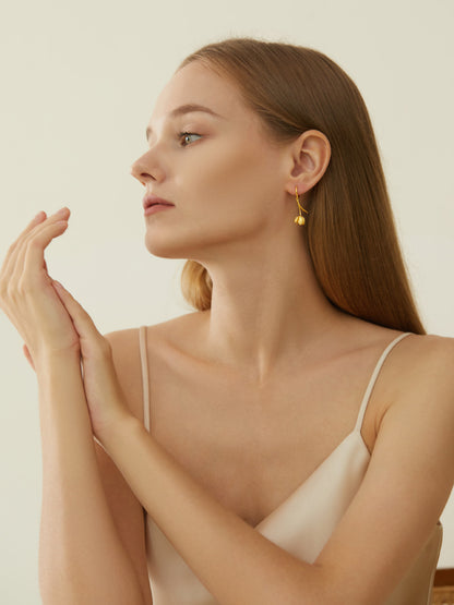 The Tulips-Earrings — model wearing gold-tone tulip earring