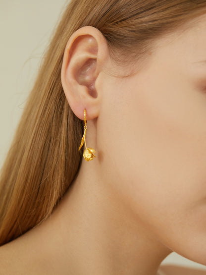 The Tulips-Earrings — close-up of gold-tone tulip earring worn on an ear