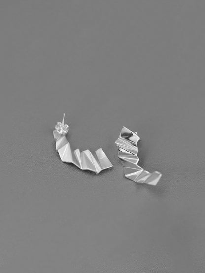 The Origami-Earrings — front and back views of silver-tone folded earrings