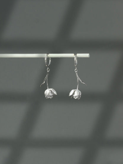 The Tulips-Earrings — silver-tone tulip earrings hanging from a bar