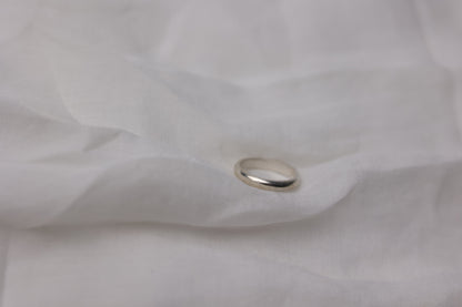 Handcrafted Minimalist Basic Silver Ring — smooth silver band on pale fabric
