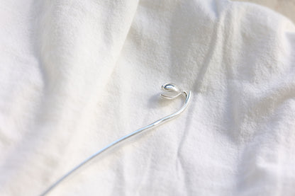 Magnolia Flower Hair Pin — magnolia-shaped hair pin on pale fabric
