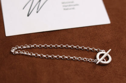 Handcrafted The Minimalist Basic Bracelet — close-up of chain links and toggle clasp