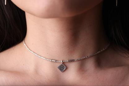 The SUN Set — sun-pendant necklace worn around the neck
