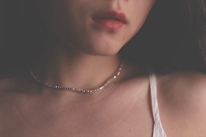 Beaded necklace worn around the neck