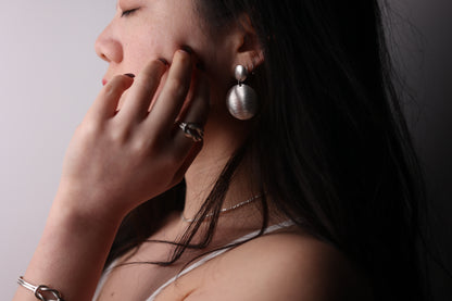 Handcrafted Frosted Minimalist Statement Earrings — round drop earrings worn with knot jewelry