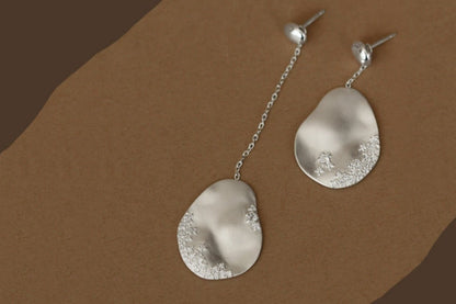 The Dune — silver-tone oval drop earrings with chain extensions