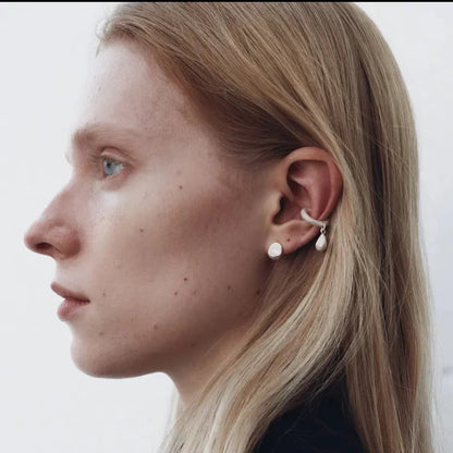 The Water Drops-Minimal Ear Stud — water-drop stud worn with other ear jewelry