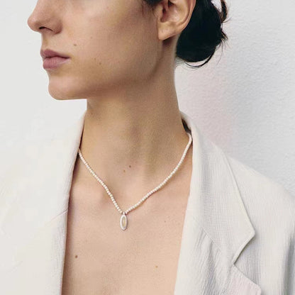 The White- Stone Necklace — necklace worn with a white jacket