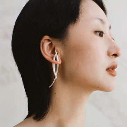 The Bamboo Leaf-Ear Stud — curved leaf stud worn on an ear
