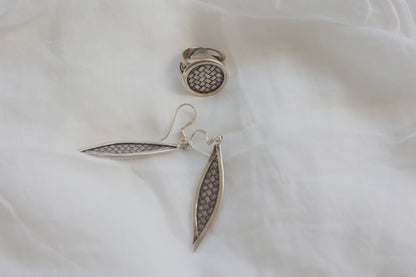 The Weaved Set — top view of woven-pattern ring and earrings