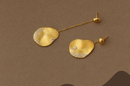 The Dune — gold-tone oval drop earrings with chain extensions