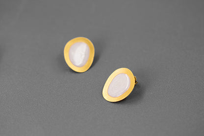 The Color Drop-Earrings — pale oval earrings with gold-tone borders