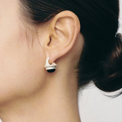 The Classic Agate-B & W — black stone earring worn on an ear