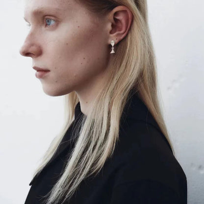 The Hourglass-Ear Stud — side view of model wearing hourglass studs