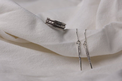 The Tribe Set — textured ring and slender drop earrings on fabric