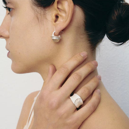 The Classic Agate-B & W — stone earring worn with a matching ring