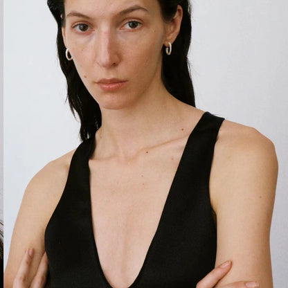 The Seashell-Ear Hoop — front view of model wearing textured hoops