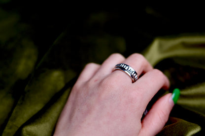 The Circles-Ring — textured spinning ring worn on a hand