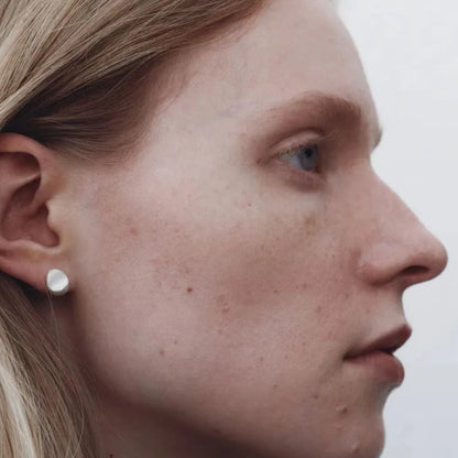 The Water Drops-Minimal Ear Stud — close-up of water-drop stud worn on an ear