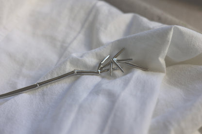 Bamboo Hair Pin — close-up of bamboo-shaped hair pin on fabric