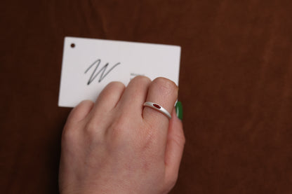 The Red Agate Silver Ring — red-stone ring worn on a hand