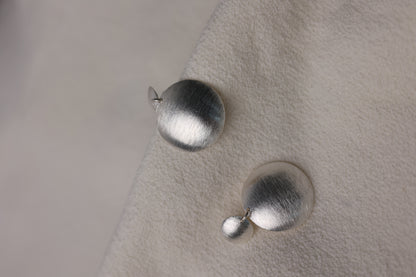 Handcrafted Frosted Minimalist Statement Earrings — round drop earrings on textured pale fabric