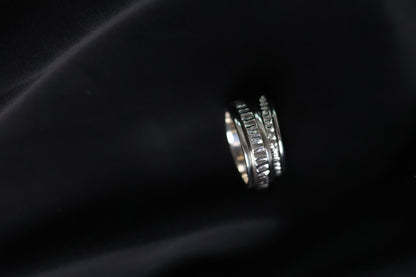 The Circles-Ring — spinning ring displayed on black fabric