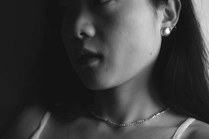 Minimalist Handcrafted Frosted Silver Ear Stud — model wearing frosted stud and necklace