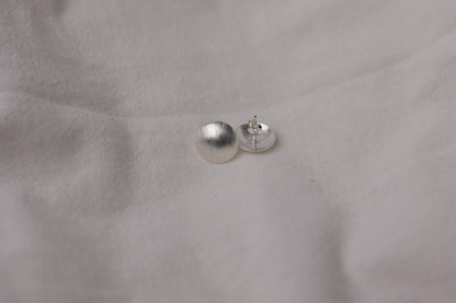 Minimalist Handcrafted Frosted Silver Ear Stud — close-up of ear stud and butterfly back