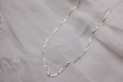 Handcrafted Minimalist Silver Chain Necklace — close-up of necklace chain on fabric