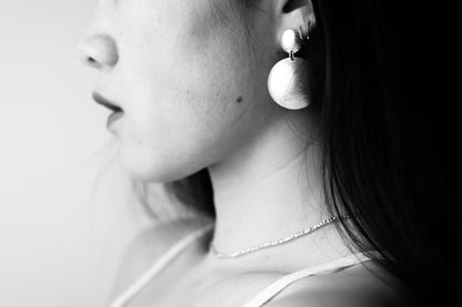 Handcrafted Frosted Minimalist Statement Earrings — round drop earrings worn on an ear