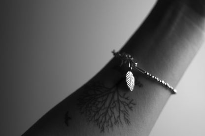 The Leaf Set — leaf-pendant bracelet worn on a wrist