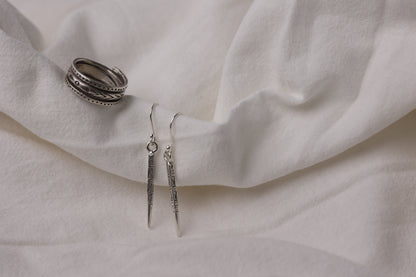 The Tribe Set — ring and slender drop earrings on folded fabric
