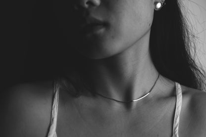Minimalist Handcrafted Frosted Silver Ear Stud — front view of model wearing round stud