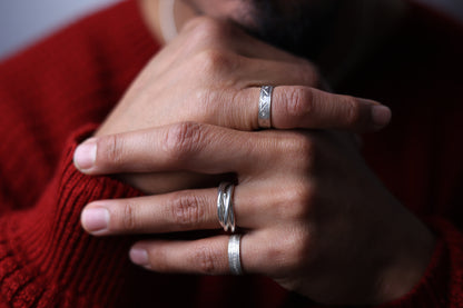 Handcrafted Interlocked Round Silver Ring — interlocked ring worn with other rings
