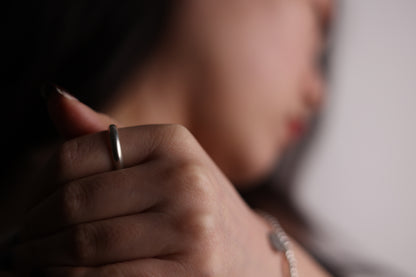 Handcrafted Minimalist Basic Silver Ring — smooth band shown with a knot bangle
