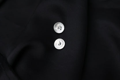 Minimalist Handcrafted Frosted Silver Ear Stud — back view of round studs on black fabric
